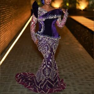 Selling this 2 piece (top and skirt) set, with fan and veil.